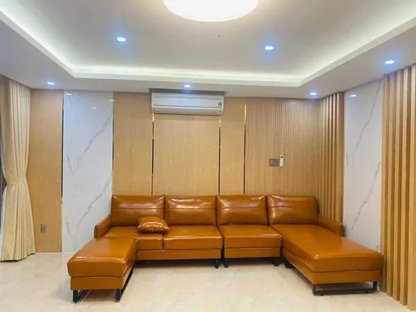 Mẫu phòng khách đẹp với tường ốp nhựa PVC họa tiết độc đáo
