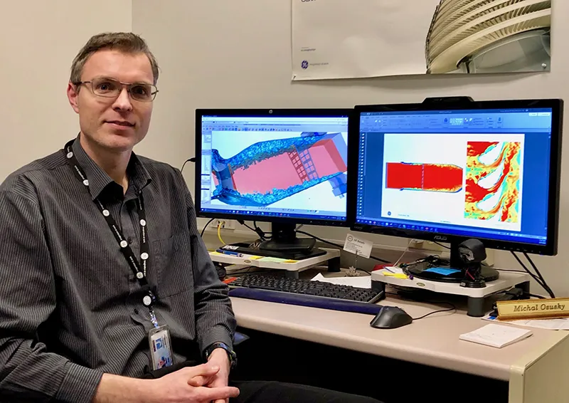 Michal Osusky, trưởng dự án của nhóm Nhiệt học và nhóm Tính toán động lực học chất lưu (CFD) của GE Research đang sử dụng siêu máy tính để cải thiện thiết kế và hiệu suất của động cơ phản lực và máy phát điện tuabin.