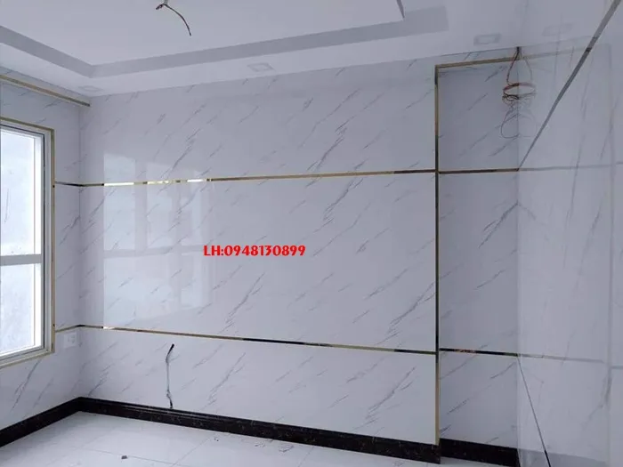 Phòng khách sang trọng với tấm ốp tường nhựa giả đá hoa cương